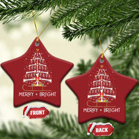 Two red star-shaped radiology ornaments with dancing skeleton tree and “MERRY + BRIGHT”