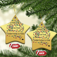 Gold star-shaped Christmas ornaments (2) with multicolor string-light quote “It’s fine, I’m fine, everything is fine”.