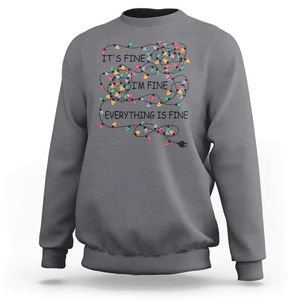 Light gray crewneck sweatshirt with festive lightbulb graphic and 'It's fine' text