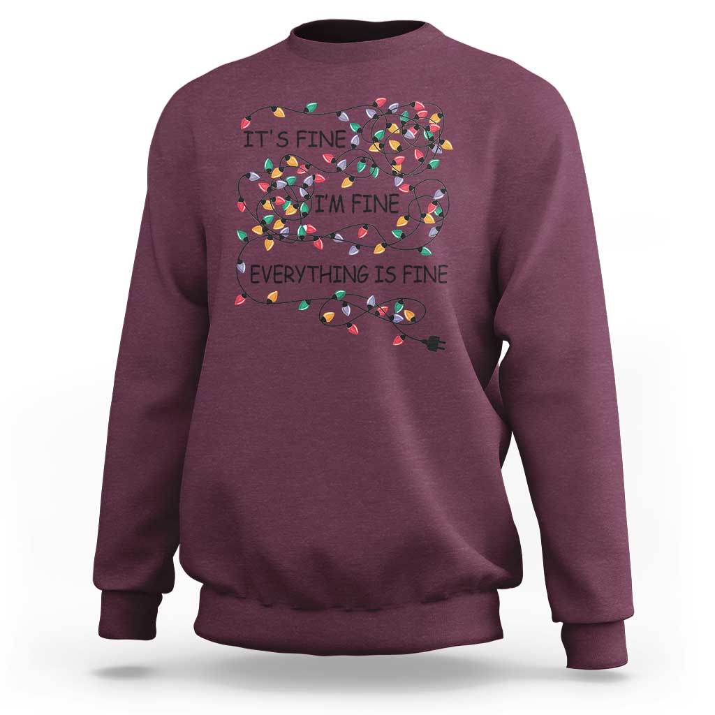 Maroon crewneck sweatshirt with festive lightbulb graphic and 'It's fine' text