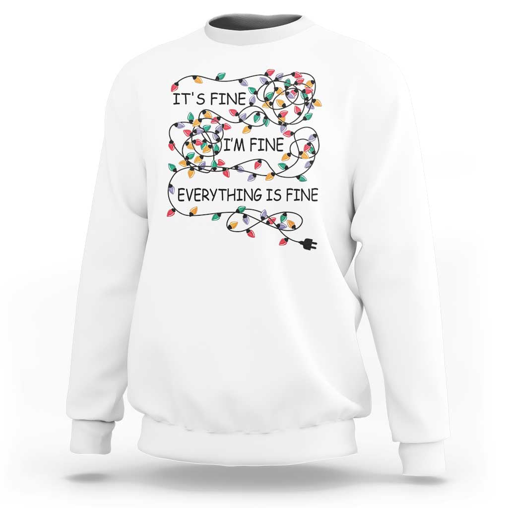 White crewneck sweatshirt with festive lightbulb graphic and 'It's fine' text