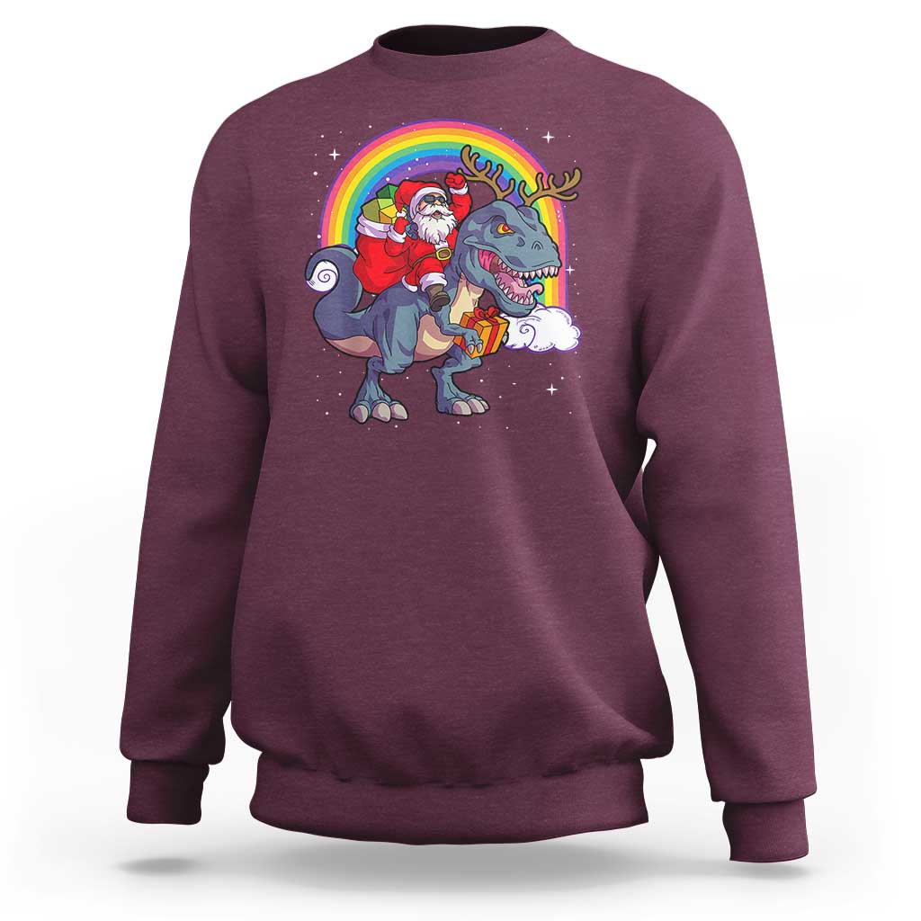 Maroon crewneck sweatshirt with Santa riding a dinosaur-deer rainbow graphic