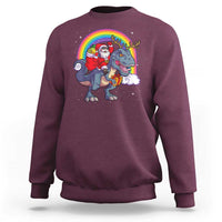 Maroon crewneck sweatshirt with Santa riding a dinosaur-deer rainbow graphic