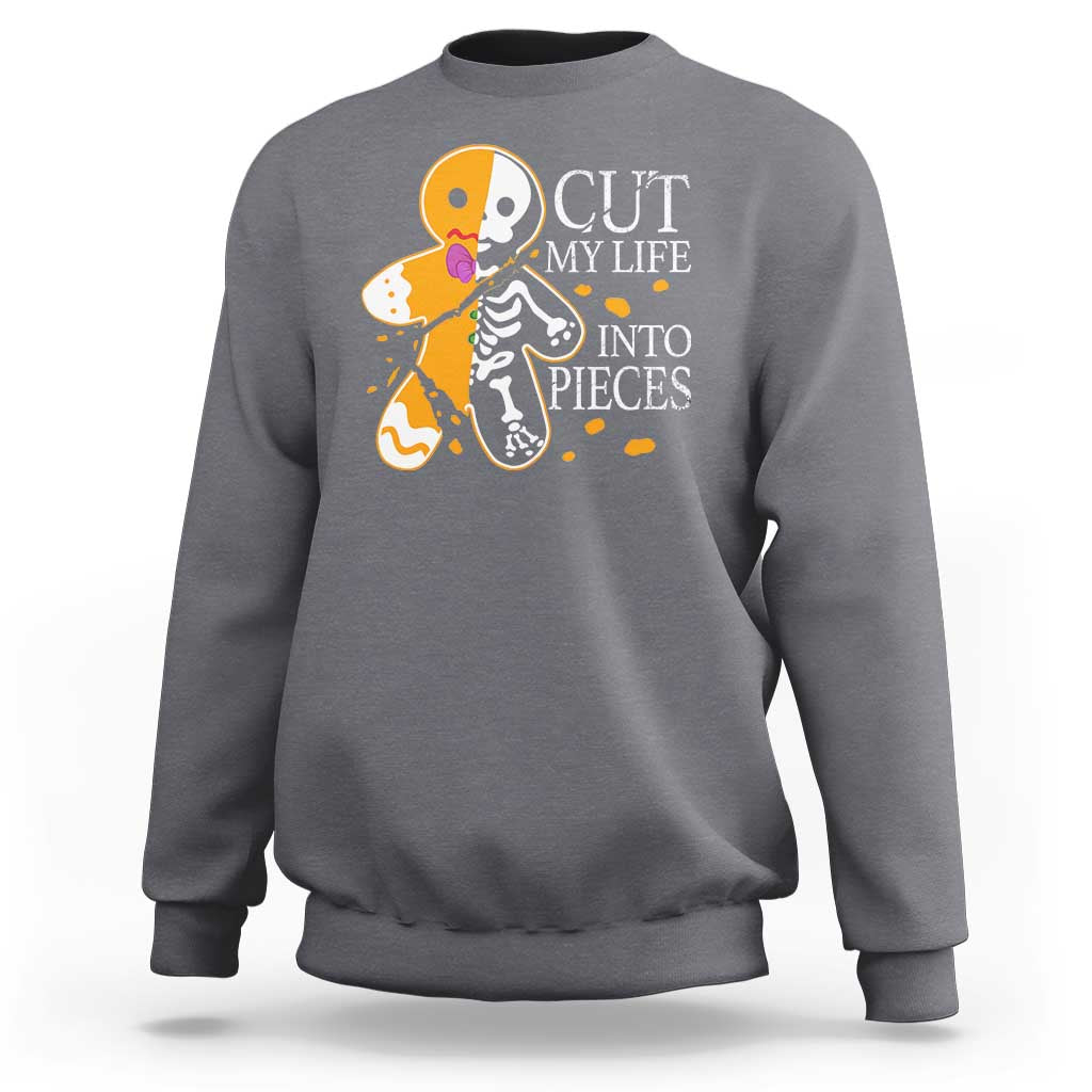 Charcoal gray crewneck sweatshirt with skull and guitars graphic and “CUT MY LIFE INTO PIECES”.