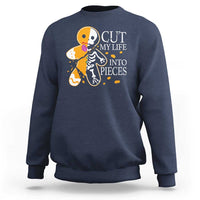 Navy crewneck sweatshirt with skull and guitars graphic and “CUT MY LIFE INTO PIECES” text.