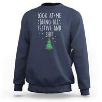 Navy crewneck Christmas sweatshirt with white “Look at me being all festive and shit” text and fir graphic