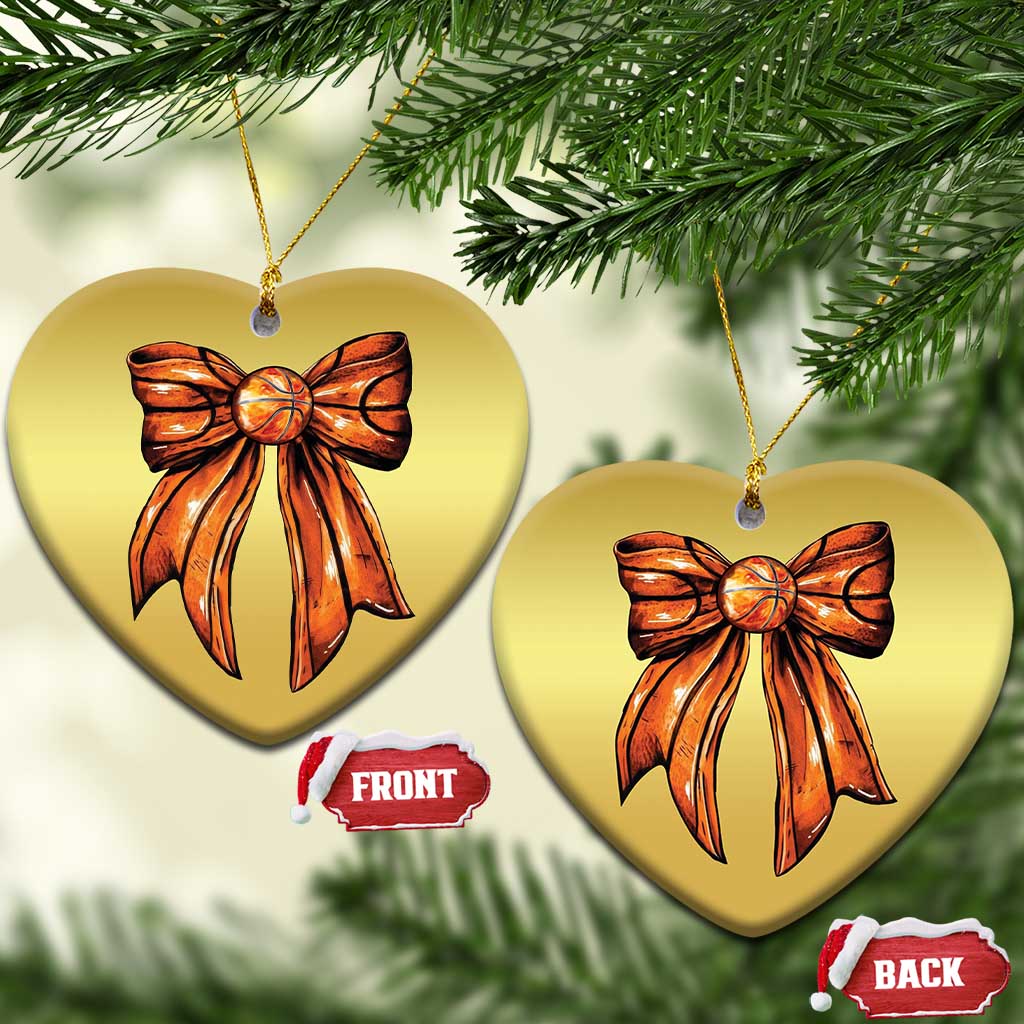 Two gold heart Christmas ornaments featuring orange ribbon bow and gold hanging cord