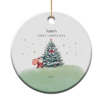 Personalized round baby’s first Christmas ornament with tree, stars, and Name’s text, 2024