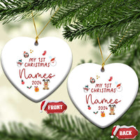 Two white heart-shaped Christmas ornaments with gold hooks; 'My 1st Christmas Names 2024'.