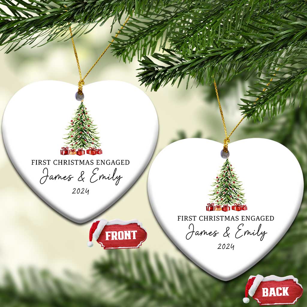 Two personalized heart-shaped Christmas ornaments hanging with tree graphic and "James & Emily 2024"