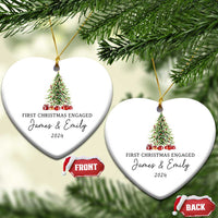 Two personalized heart-shaped Christmas ornaments hanging with tree graphic and "James & Emily 2024"