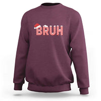 Maroon crewneck sweatshirt with 'BRUH' Christmas graphic in red-and-white stripes