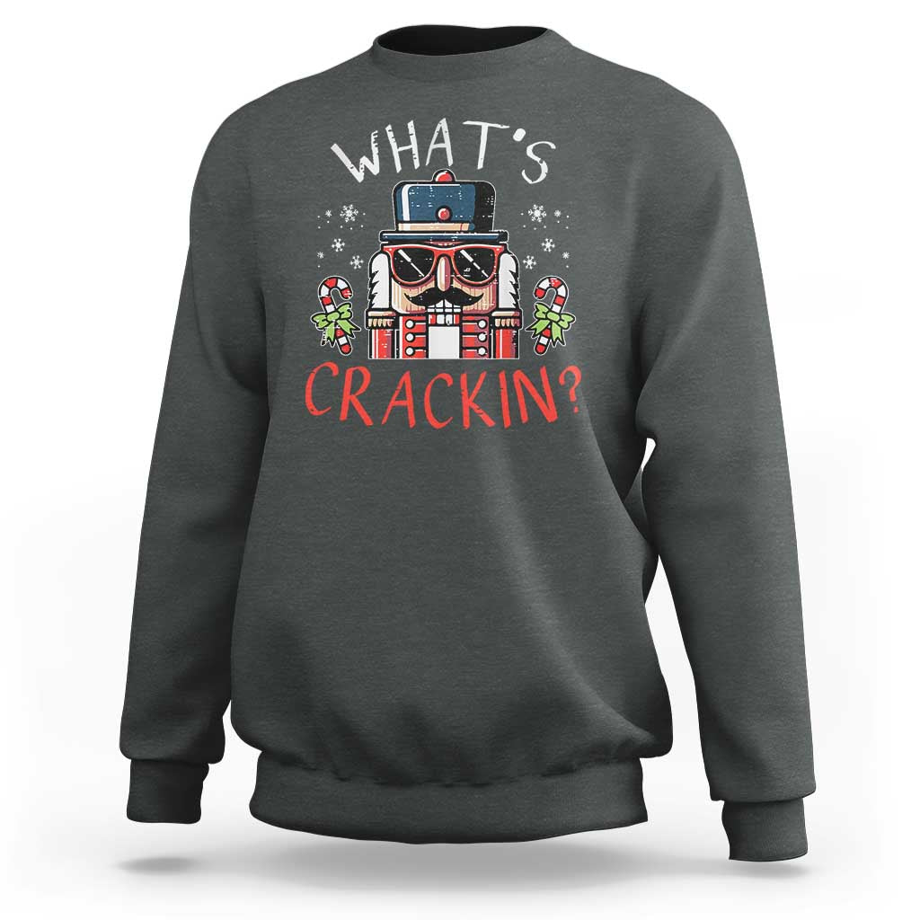 Charcoal crewneck sweatshirt with nutcracker graphic and "What’s Crackin?" text