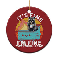 Red round Christmas ornament with raccoon holding a noodle cup, “It’s Fine, I’m Fine” text