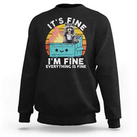 Black raccoon graphic sweatshirt with “I’M FINE” meme text on front
