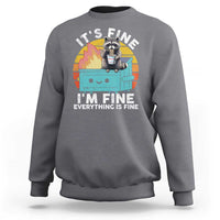 Charcoal gray raccoon graphic sweatshirt with “I’M FINE” meme text on front