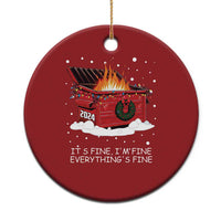 Red round Christmas ornament with flaming cart graphic and “It’s fine, I’m fine” text
