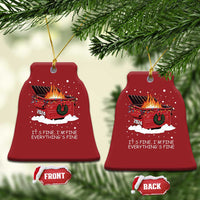Two red bell-shaped Christmas ornaments with flaming cart graphic and “It’s fine” text