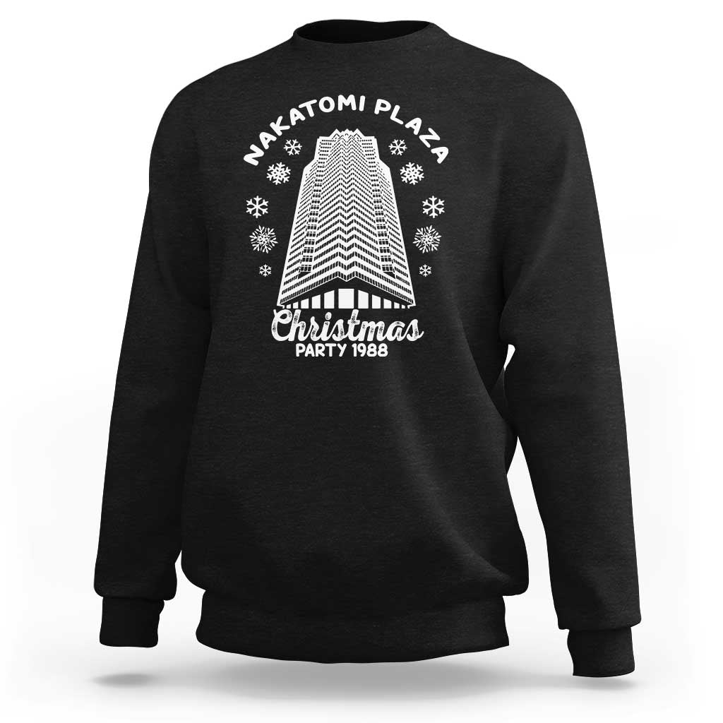 Black crewneck Christmas sweatshirt with Nakatomi Plaza tree graphic and snowflakes