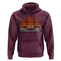 Maroon pullover hoodie with bat graphic on chest and front kangaroo pocket.