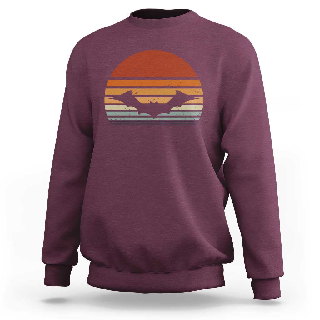 Maroon Halloween bat sweatshirt with vintage sunset bat graphic, crew neck long sleeves.