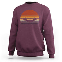 Maroon Halloween bat sweatshirt with vintage sunset bat graphic, crew neck long sleeves.