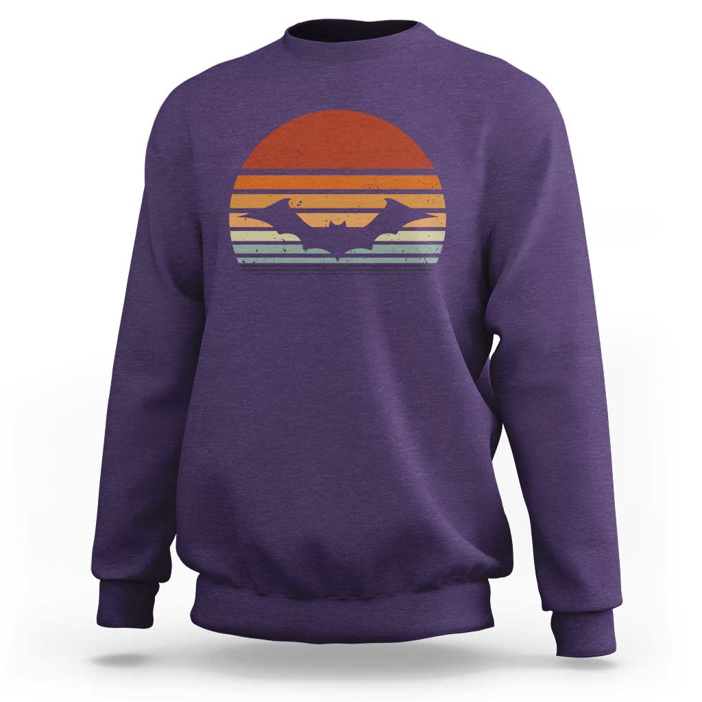 Purple Halloween bat sweatshirt with vintage sunset bat graphic, crew neck long sleeves.