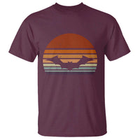 Maroon T-shirt with vintage orange bat graphic and striped sunset design
