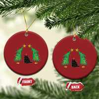 Set of two red round cat Christmas ornaments with black cat under wreath-like trees