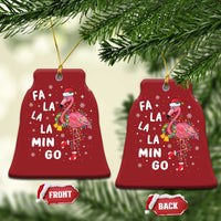 Two red bell-shaped flamingo Christmas ornaments with gold string; shows “FA LA LA MIN GO”.
