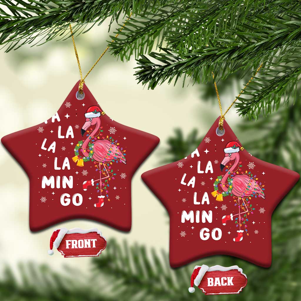 Pair of red star flamingo Christmas ornaments with gold strings and “FA LA LA MIN GO”.