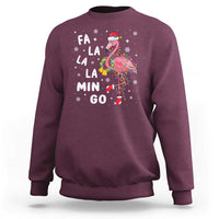 Maroon sweatshirt with flamingo holiday graphic and 'FA LA LA MIN GO' text