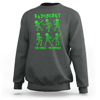 Dark heather sweatshirt with green Radiology skeleton graphic and 'You pose—We expose'.