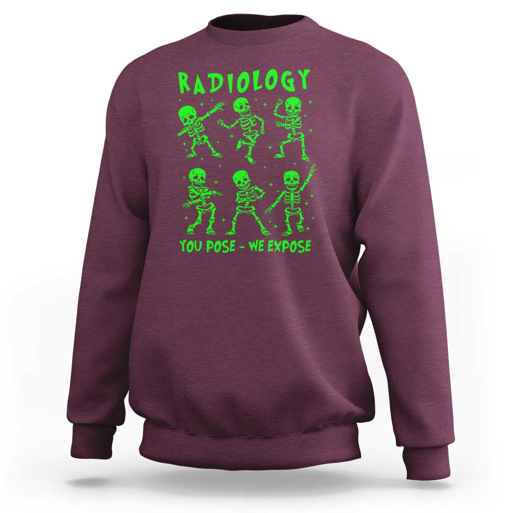Maroon sweatshirt with green Radiology skeleton graphic and 'You pose—We expose'.