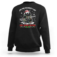 Black crewneck sweatshirt with cat Christmas graphic and 'naughty list' slogan