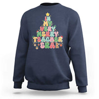 Navy teacher sweatshirt with colorful “Merry Teacher” holiday graphic on front.
