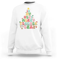 White teacher sweatshirt with colorful “Merry Teacher” holiday graphic on front.