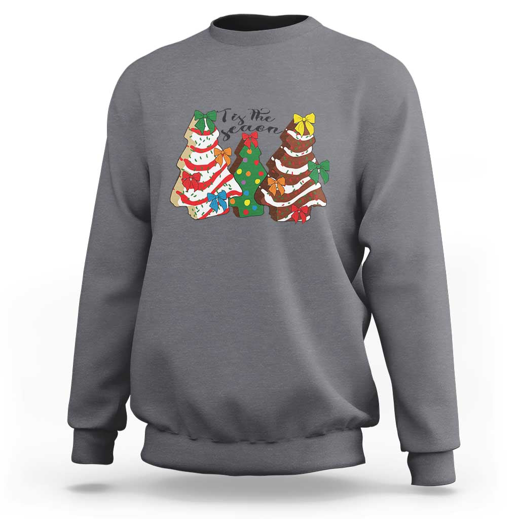 Gray heather crewneck sweatshirt with long sleeves and colorful Christmas character graphic