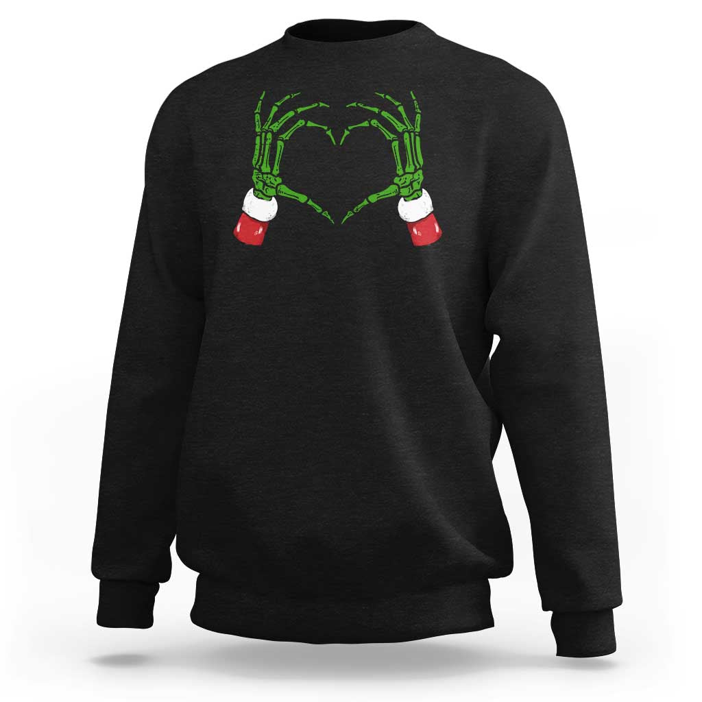 Black sweatshirt with green skeleton-heart hands graphic on chest
