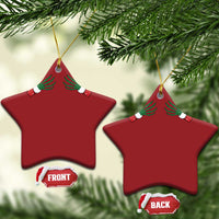 Two red star-shaped Christmas ornaments with green skeleton hands and gold hanging loops