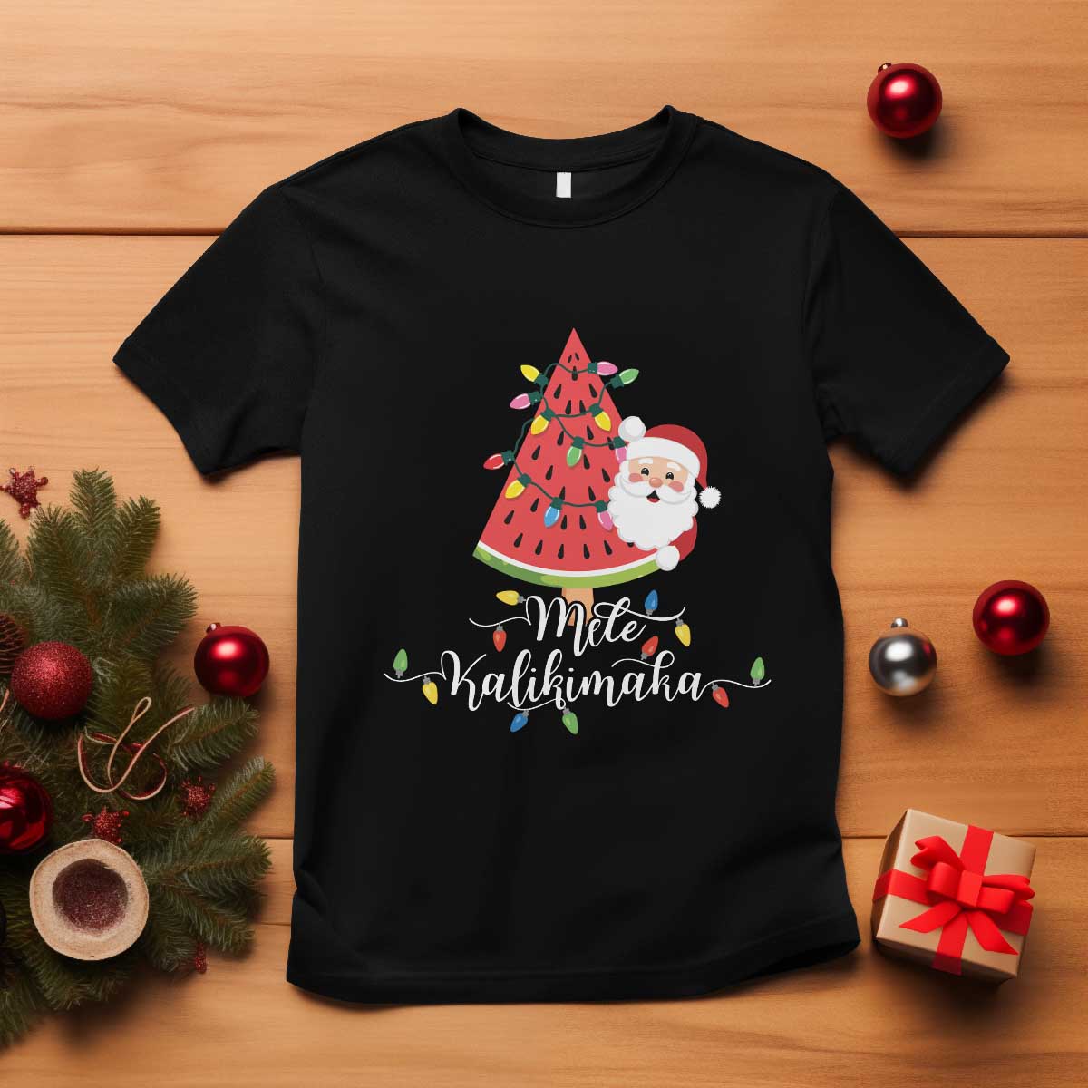 Black T-shirt with tropical Christmas tree and Santa graphic at center.