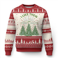 Red crewneck Christmas sweater with white snowflake pattern, pine trees, and slogan text