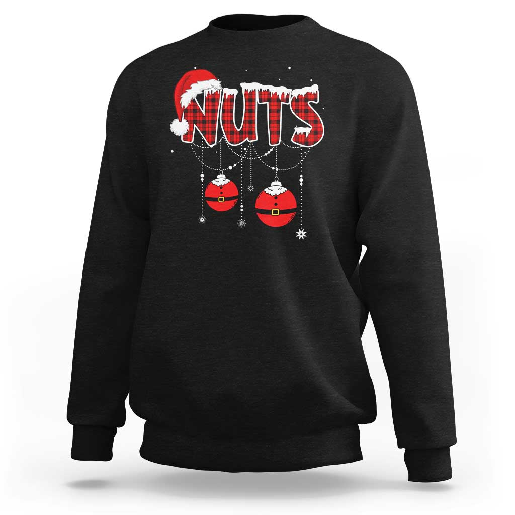 Black crewneck sweatshirt with 'NUTS' holiday graphic and hanging ornament balls
