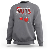 Charcoal gray crewneck sweatshirt with 'NUTS' holiday graphic and hanging ornament balls