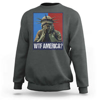Dark heather sweatshirt with Statue of Liberty graphic and “WTF AMERICA?” text on chest