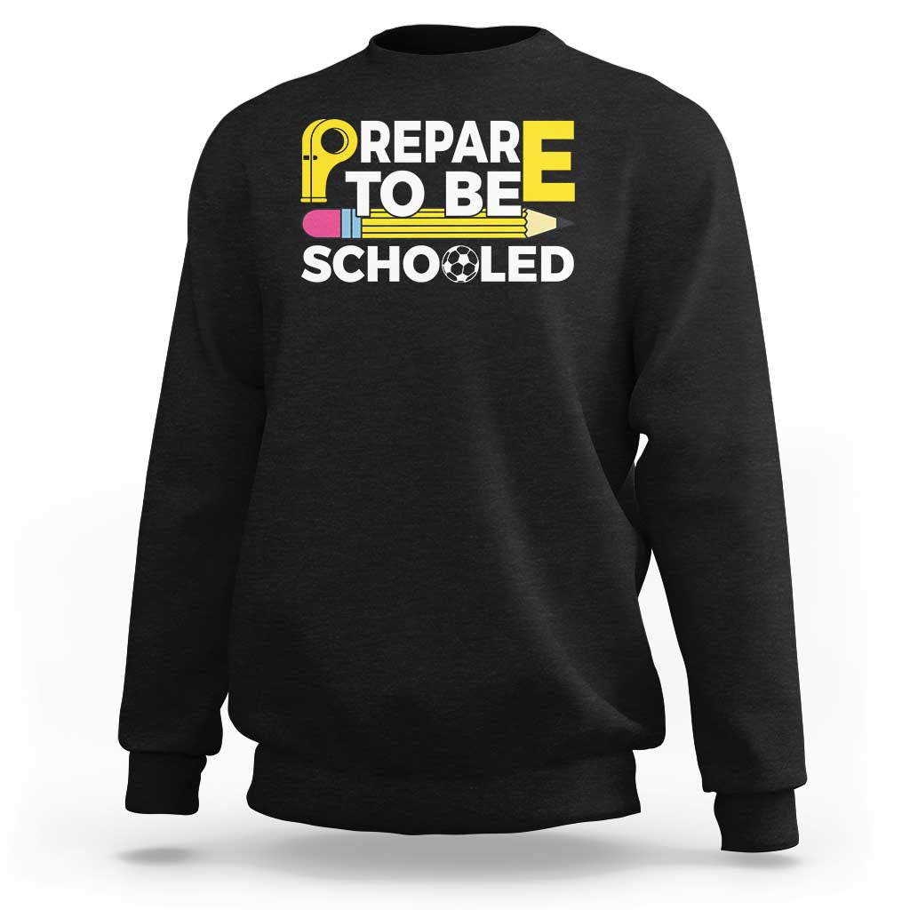Black crewneck sweatshirt with “Prepare To Be Schooled” teacher graphic on front