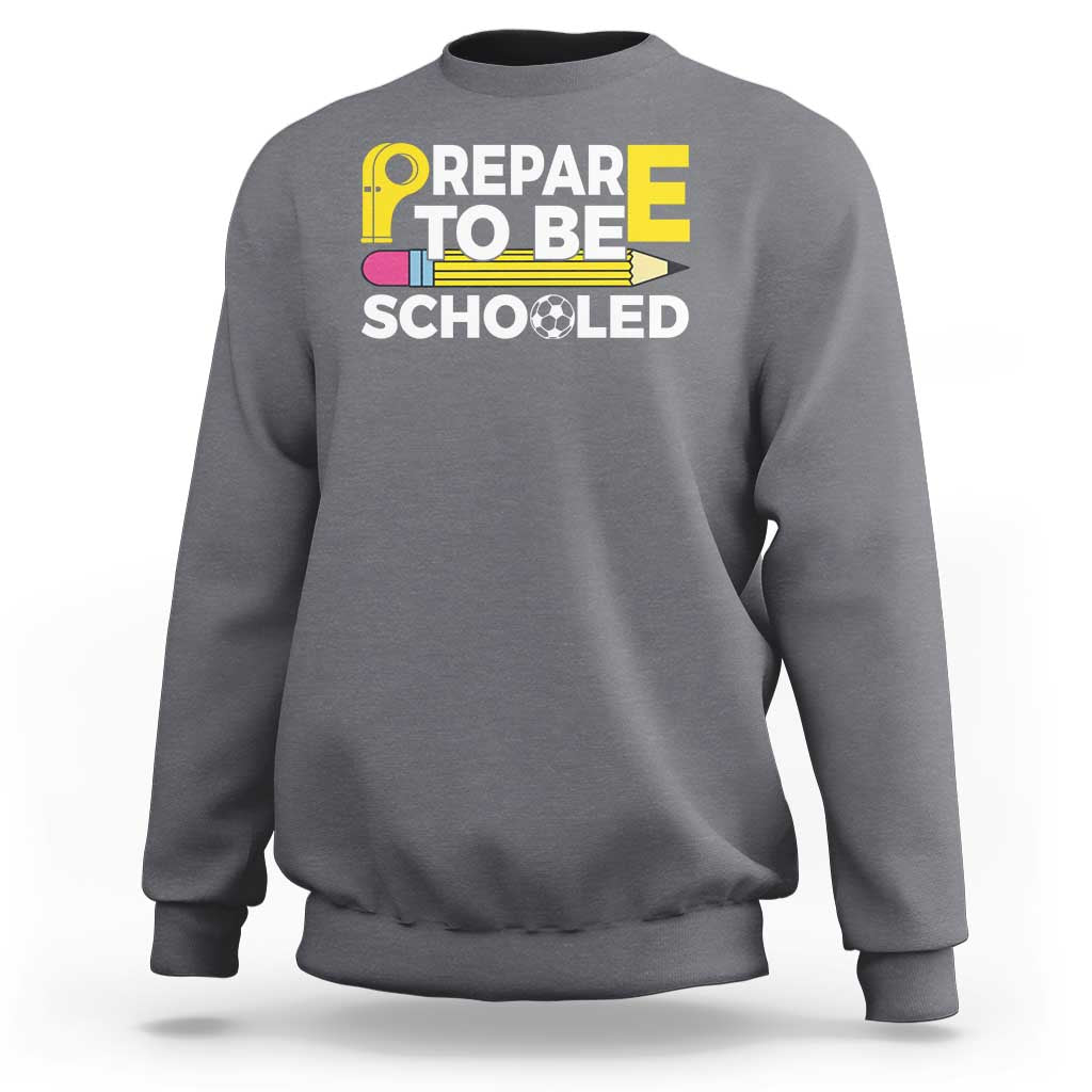 Light charcoal heather crewneck sweatshirt with “Prepare To Be Schooled” teacher graphic