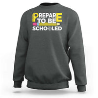 Charcoal heather crewneck sweatshirt with “Prepare To Be Schooled” teacher graphic
