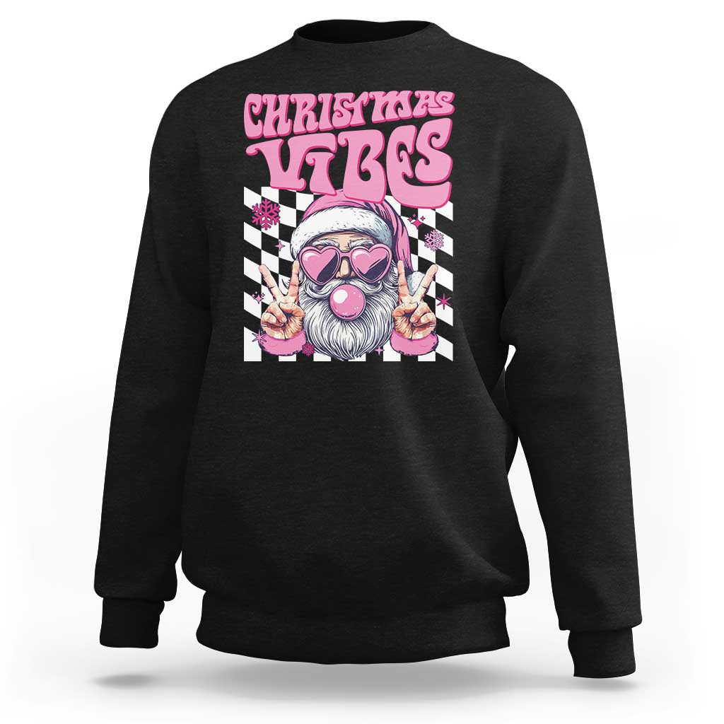 Black crewneck sweatshirt with pink "CHRISTMAS VIBES" Santa graphic on front