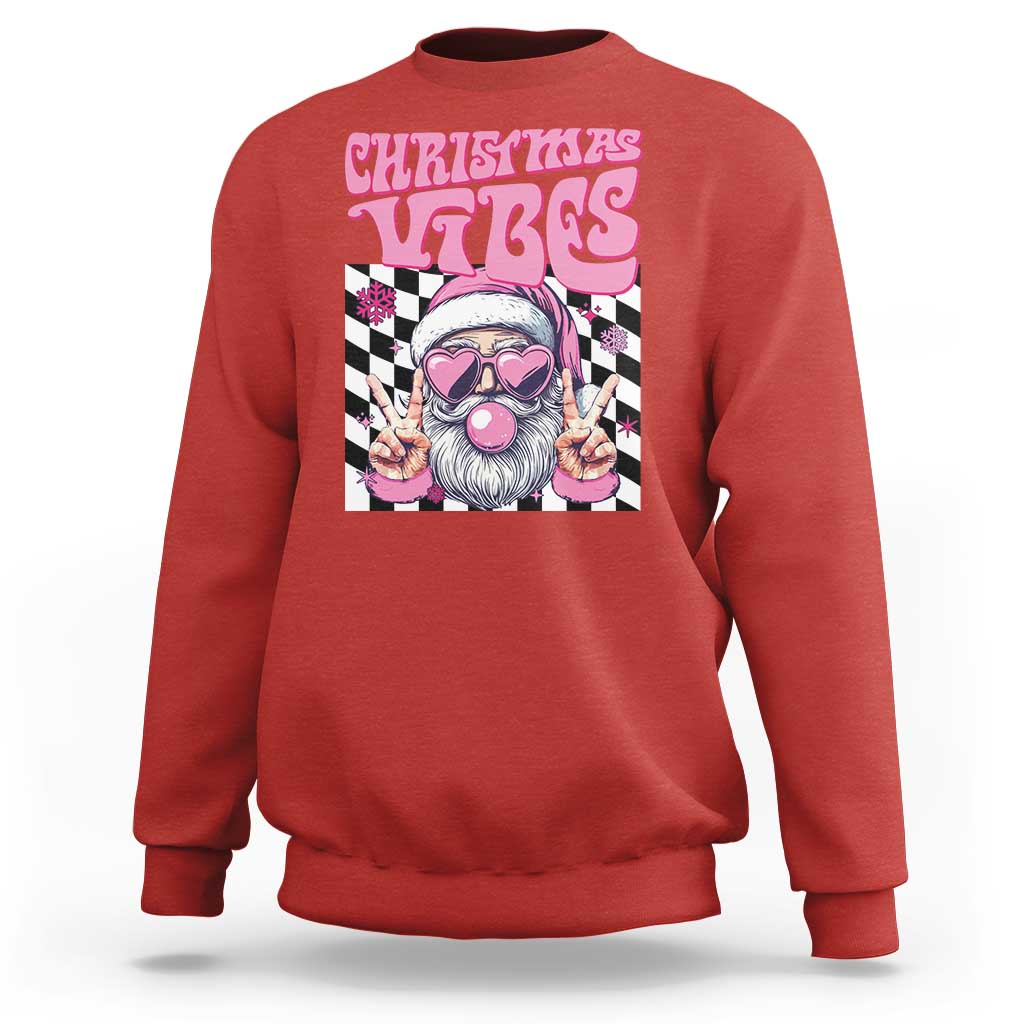 Red crewneck sweatshirt with pink "CHRISTMAS VIBES" Santa graphic on front